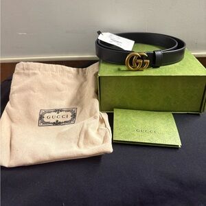 Gucci Black Belt with Gold GG Emblem